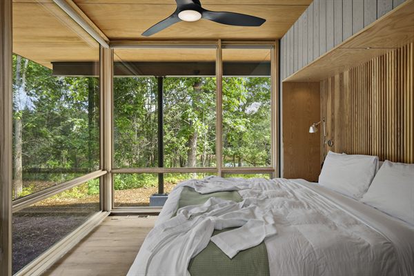 Oak and Ember cabin interior with warm finishes and wooded views