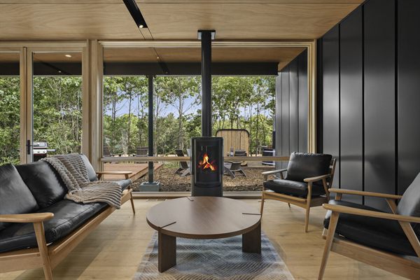 Oak and Ember cabin interior with warm finishes and wooded views