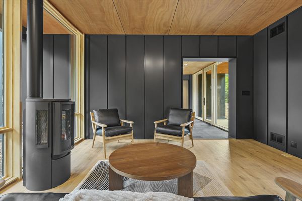 Oak and Ember cabin interior with warm finishes and wooded views