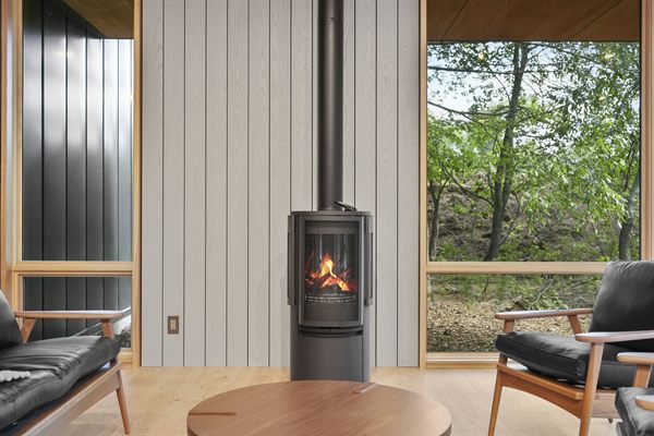 Oak and Ember cabin interior with warm finishes and wooded views