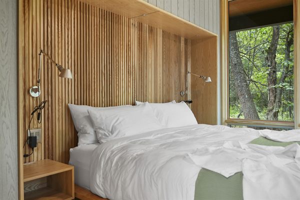 Oak and Ember cabin interior with warm finishes and wooded views