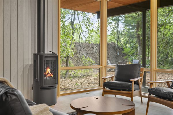 Oak and Ember cabin interior with warm finishes and wooded views