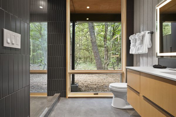 Oak and Ember cabin interior with warm finishes and wooded views