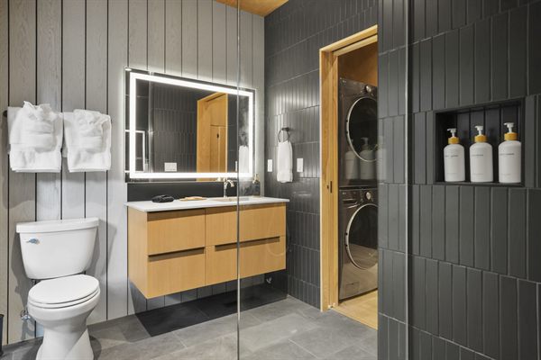 Oak and Ember cabin interior with warm finishes and wooded views