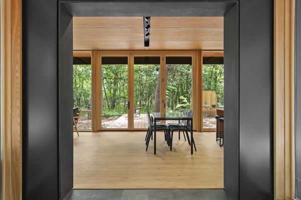 Oak and Ember cabin interior with warm finishes and wooded views