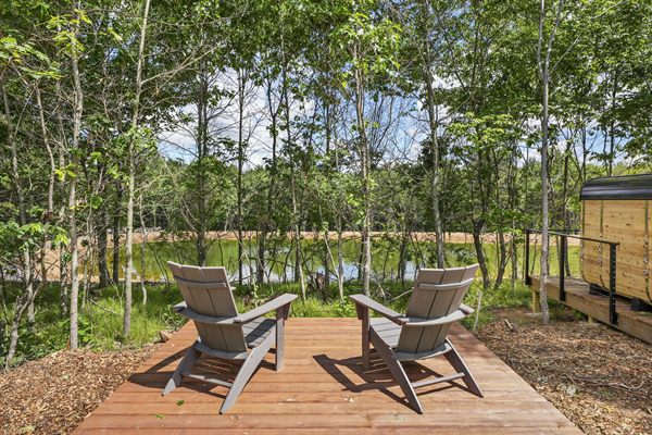 Oak and Ember modern cabin exterior and wooded outdoor space