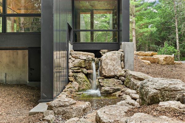 Oak and Ember modern cabin exterior and wooded outdoor space