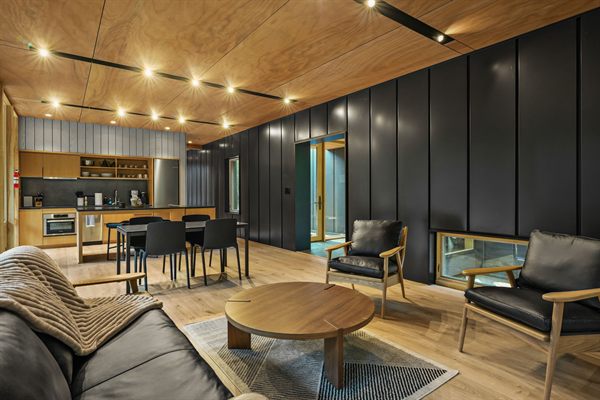 Oak and Ember cabin interior with warm finishes and wooded views