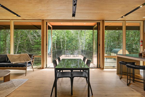 Oak and Ember cabin interior with warm finishes and wooded views