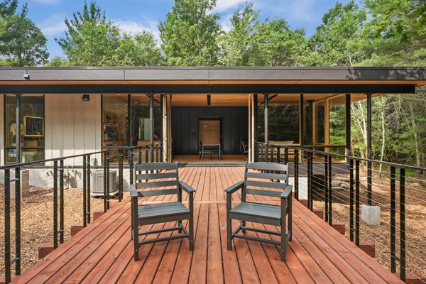 Oak and Ember modern cabin exterior and wooded outdoor space