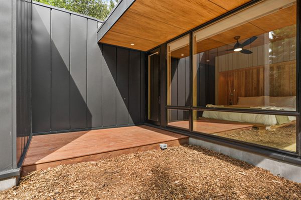 Oak and Ember modern cabin exterior and wooded outdoor space