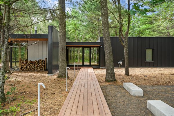Oak and Ember modern cabin exterior and wooded outdoor space