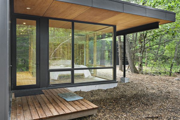 Oak and Ember cabin interior with warm finishes and wooded views