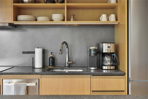 The Pines kitchen detail with warm wood cabinetry
