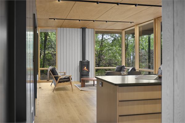 The Pines living area with wooded views