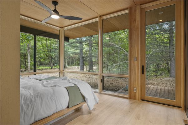 The Pines king bedroom with floor-to-ceiling windows