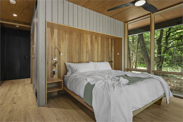 The Pines king bedroom suite with wood accent wall