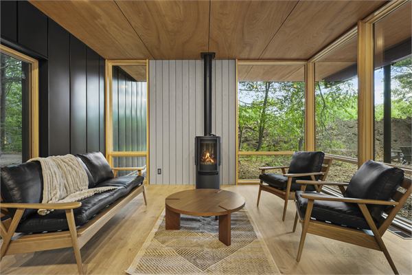 The Pines living area with gas fireplace and lounge seating