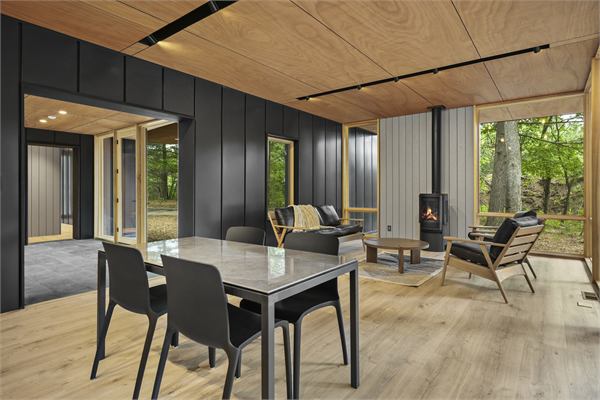 The Pines living area with wooded views