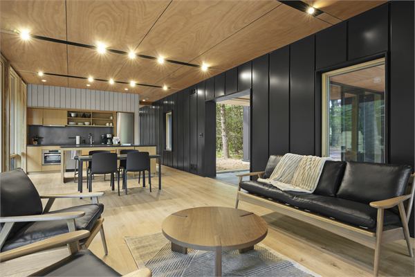 The Pines living area with wooded views