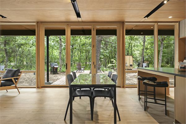 The Pines living area with wooded views