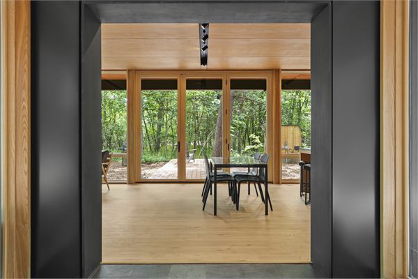 The Pines living area with wooded views