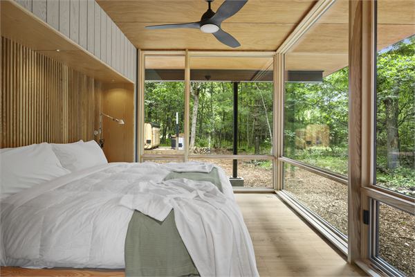 The Pines king bedroom with floor-to-ceiling windows