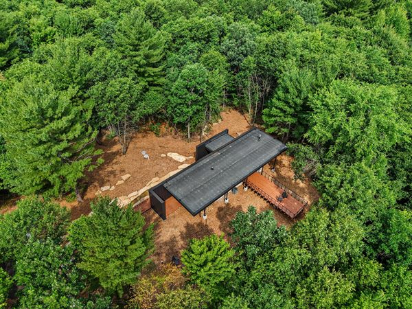 Aerial view of The Point cabin tucked into Oak and Ember wooded acreage
