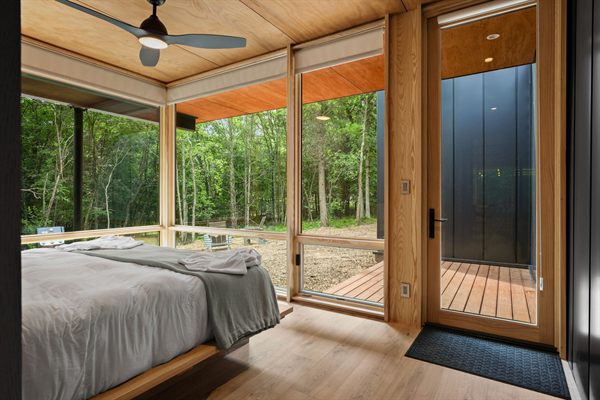 The Point king bedroom with wooded views
