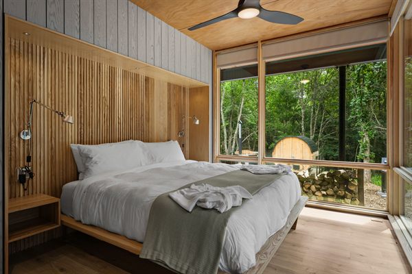 The Point king bedroom with wooded views