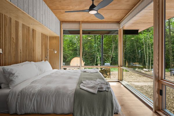 The Point king bedroom with wooded views