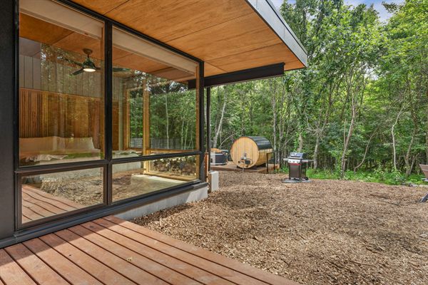 The Point private deck and outdoor gathering space in the woods