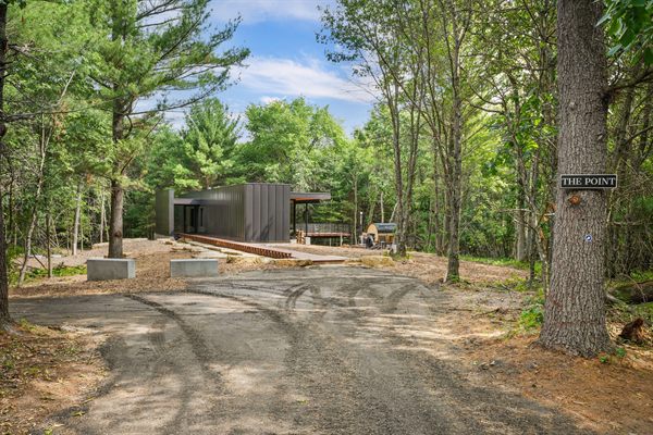The Point private deck and outdoor gathering space in the woods