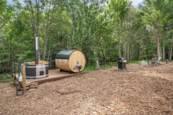 The Point private deck and outdoor gathering space in the woods