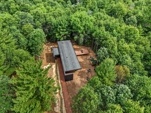 Aerial view of The Point cabin tucked into Oak and Ember wooded acreage
