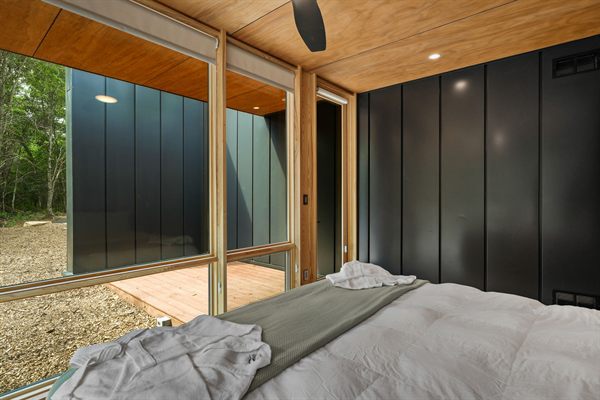 The Point modern cabin exterior surrounded by mature trees