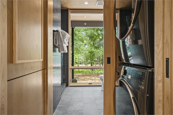 The Ridge in-cabin laundry near the bathroom and bedroom
