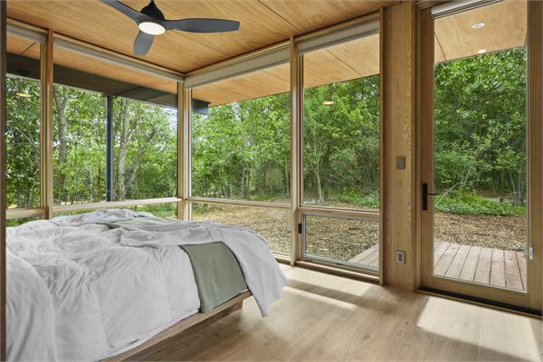 The Ridge king bedroom with wooded views