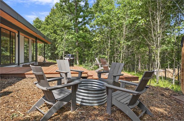 The Ridge private deck with fire pit seating and grill area