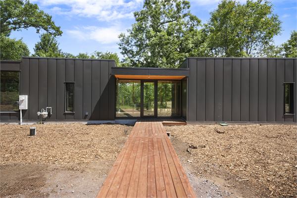The Ridge modern cabin front exterior with boardwalk entry